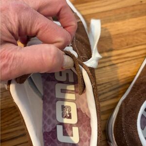 Brown and White converse sneakers